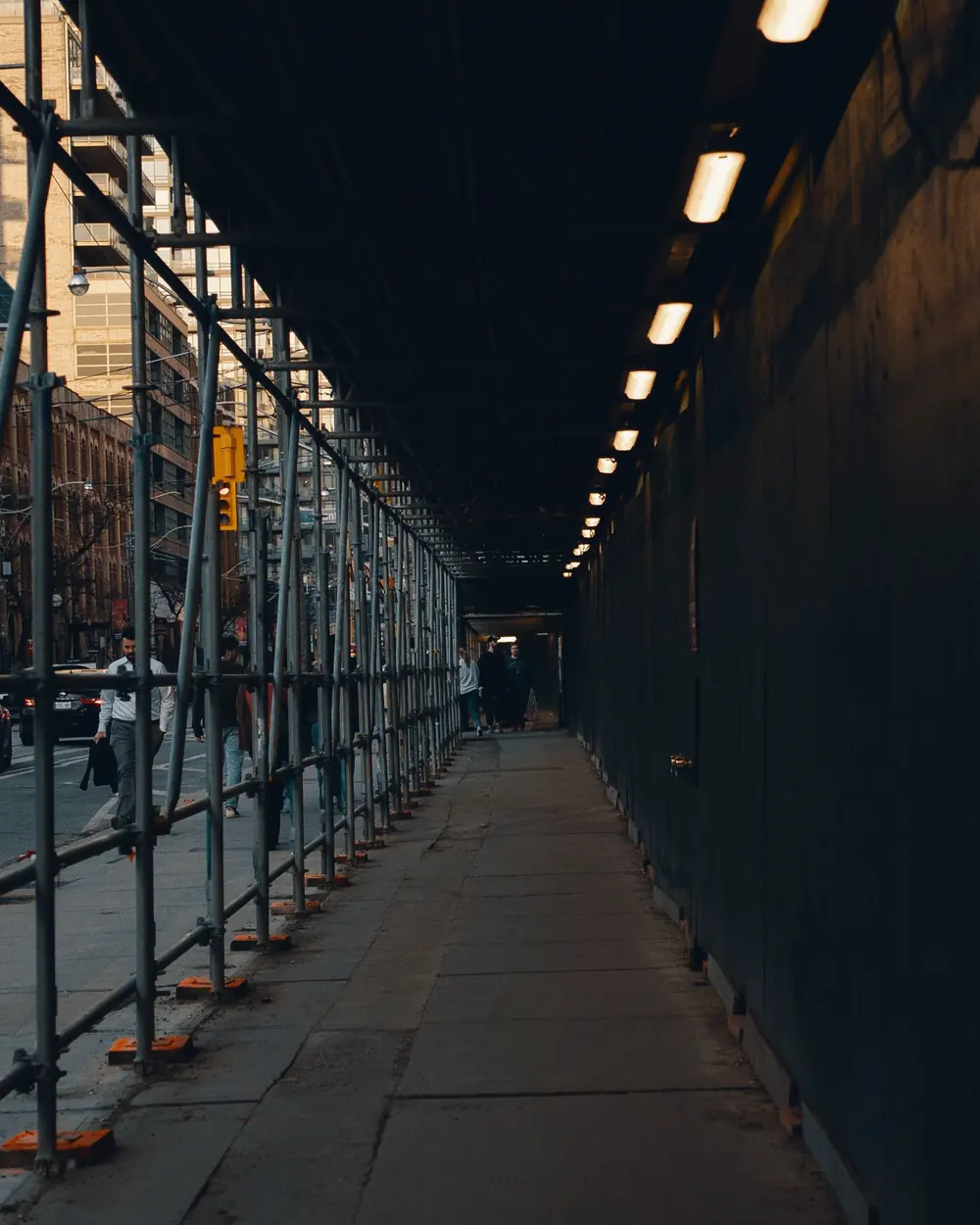 Sidewalk shed and scaffolding on a New York City street